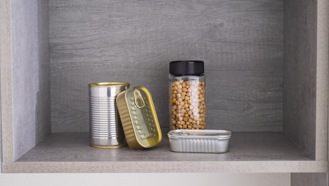 Pantry, canned food and dried legumes. Long shelf life food. Dried chickpeas in jar.